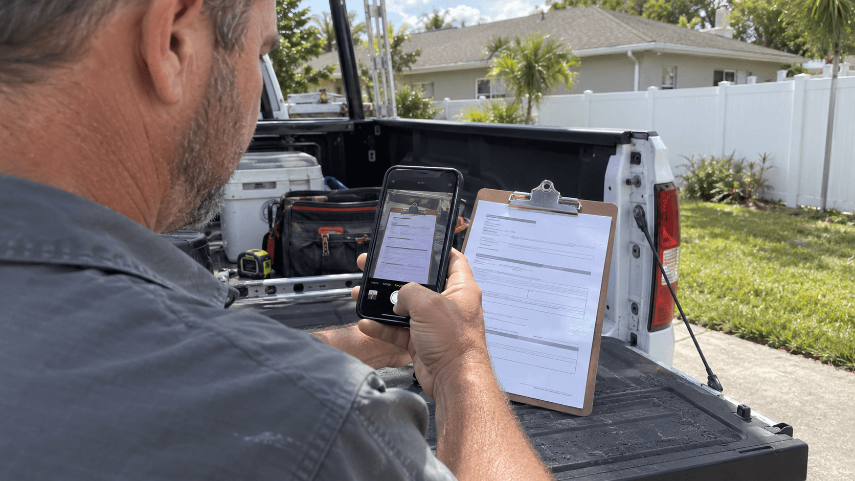 Illustration of a contractor photographing a work ticket at a Florida jobsite