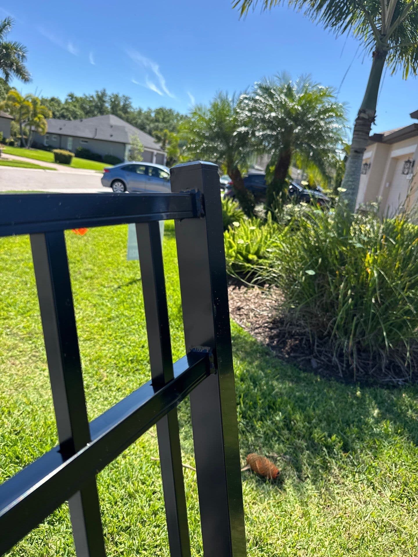 black aluminum flat_top fence installation in Bradenton, FL
